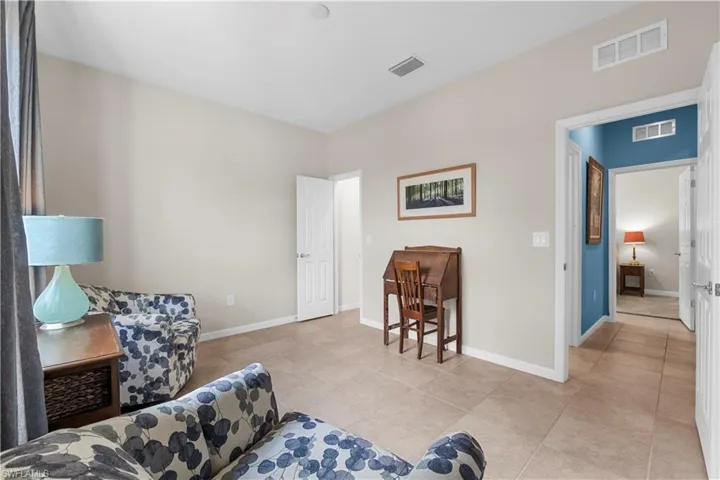Guest Bedroom 1 with walk-in closet.  16009 Palmetto Prairie Drive.  Hampton Lakes at River Hall.