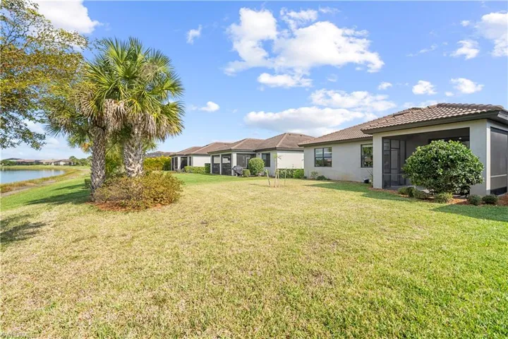 Yard and Lake view.  16009 Palmetto Prairie Drive.  Hampton Lakes at River Hall.
