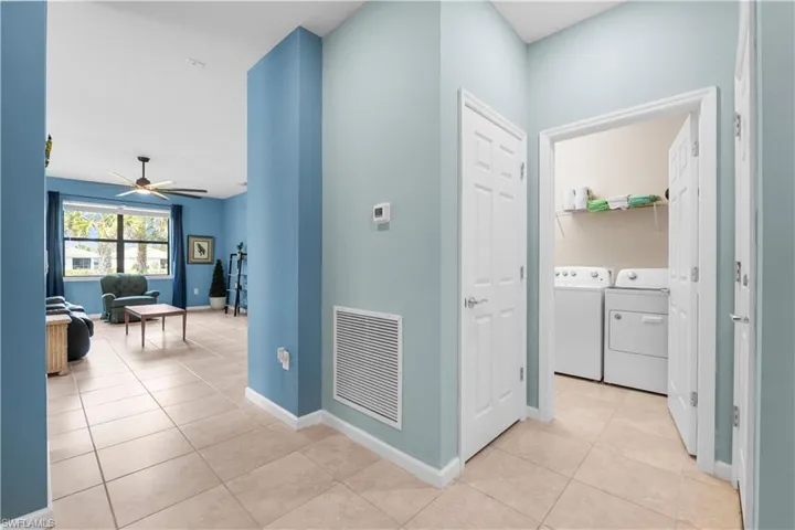 Large Laundry Room off the front hallway.  16009 Palmetto Prairie Drive.  Hampton Lakes at River Hall.