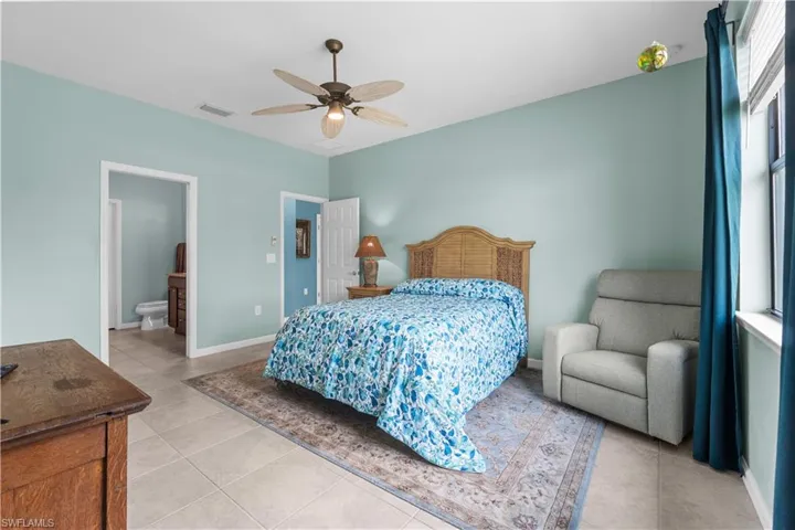 Large Master Bedroom with ensuite. 16009 Palmetto Prairie Drive.  Hampton Lakes at River Hall.
