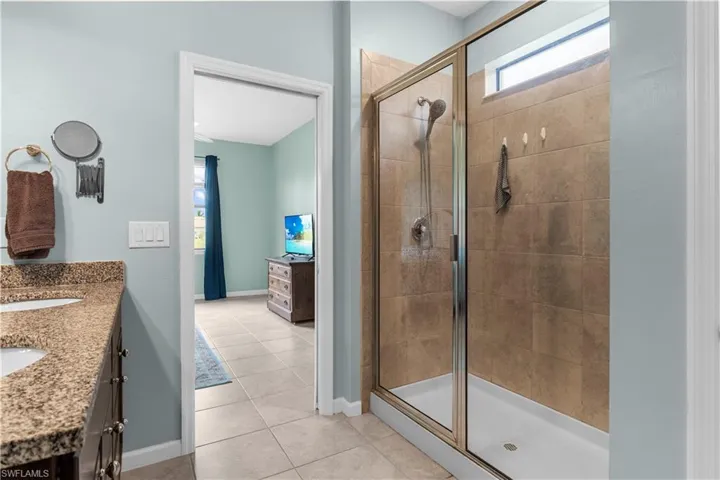 Large Master Bath with Walk-in Shower, dual sinks and granite conter top.  16009 Palmetto Prairie Drive.  Hampton Lakes at River Hall.