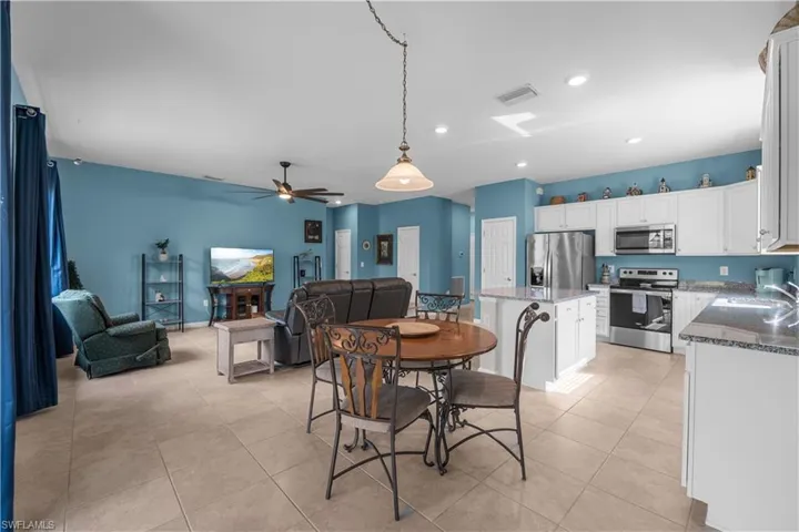 Large gathering area, Dining, Kitchen and Living/Great room. 16009 Palmetto Prairie Drive.  Hampton Lakes at River Hall.