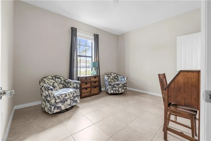 Guest Bedroom 1 with walk-in closet.  16009 Palmetto Prairie Drive.  Hampton Lakes at River Hall.