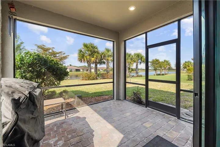 Screened Lanai with a great view of the large lake.  16009 Palmetto Prairie Drive.  Hampton Lakes at River Hall.
