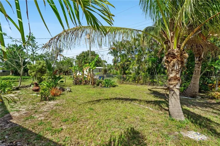 View of yard featuring fence
