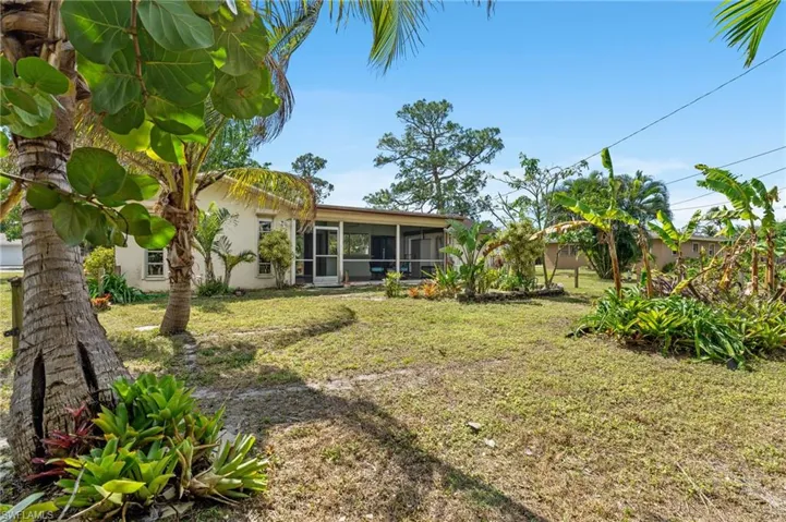 View of yard featuring a sunroom