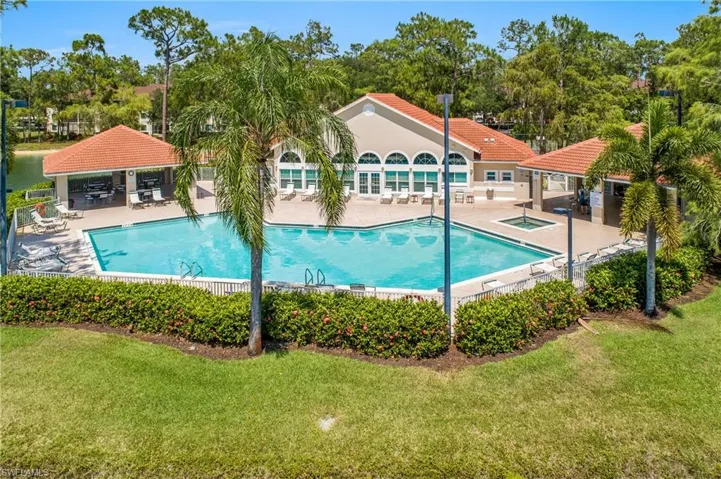 View of main swimming pool with a patio, a gazebo, and a lawn