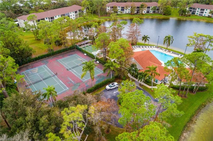 #2 Drone / aerial view featuring tennis courts and club/pool
