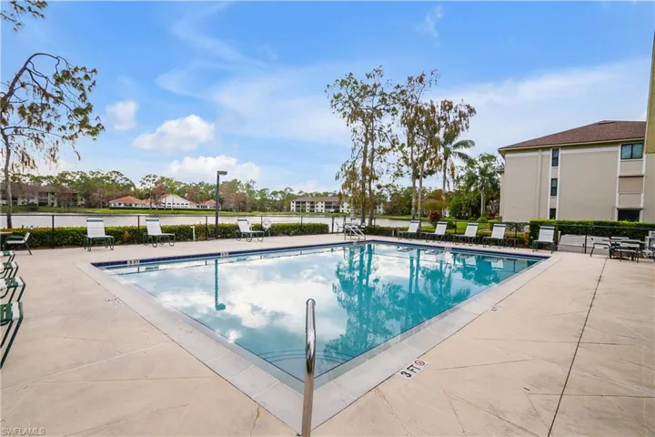 2nd View of front community pool with a patio area
