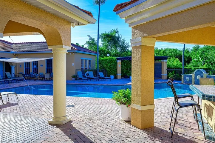 Community pool with a patio area