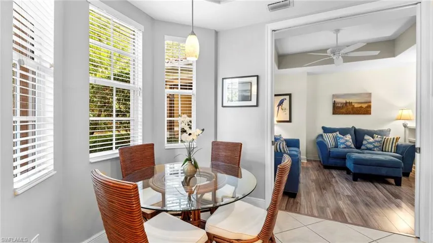 Dining area with light hardwood / wood-style floors and ceiling fan