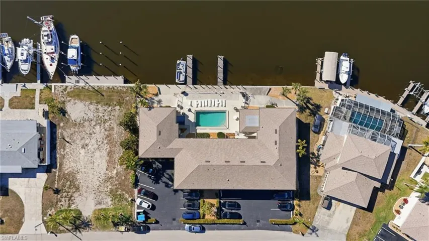 Bird's eye view of a large body of water and a pool area