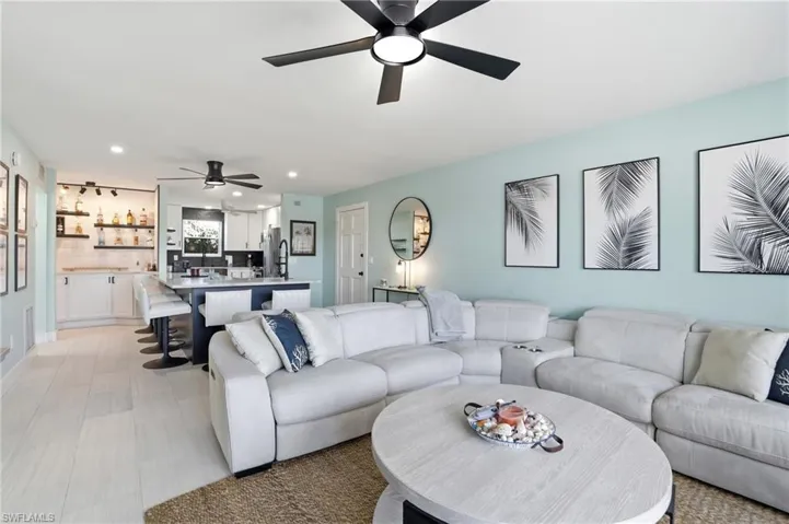 Living room featuring recessed lighting and a ceiling fan