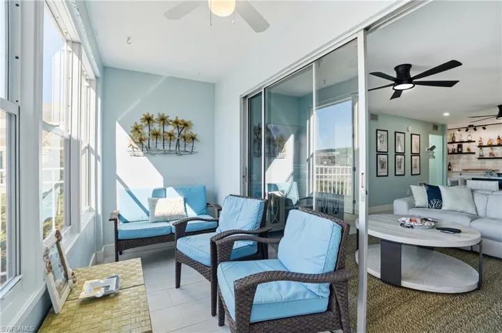 Lanai with a ceiling fan and an outdoor living space