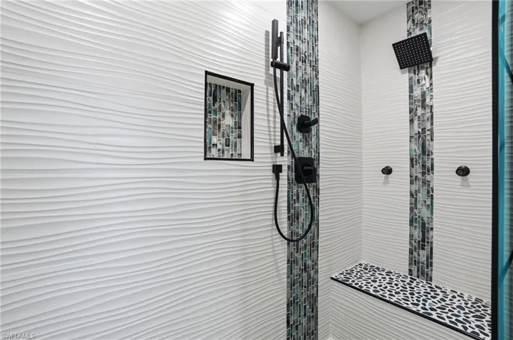Full bathroom featuring a stall shower