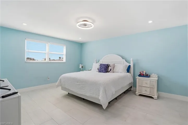 Bedroom featuring baseboards and recessed lighting