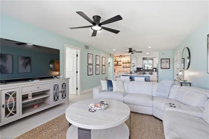 Living area featuring recessed lighting and ceiling fan
