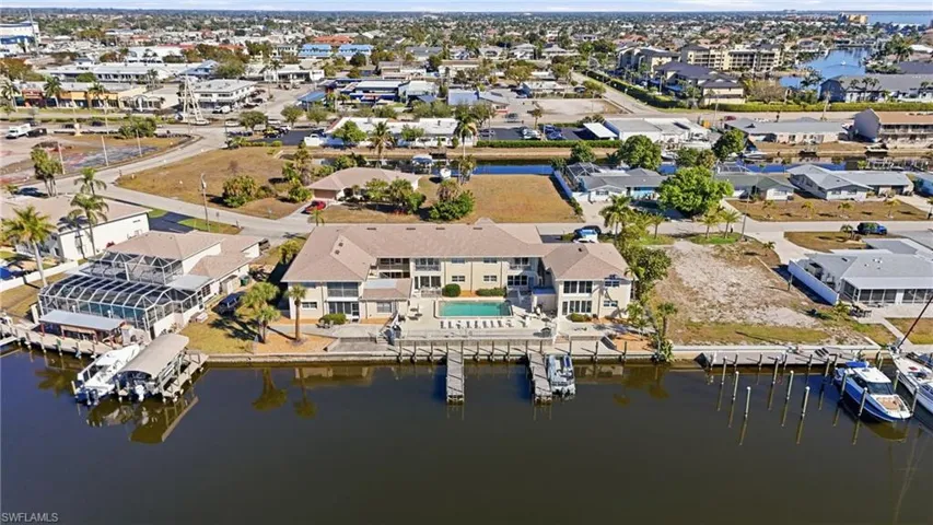 Aerial view of property's location featuring nearby suburban area