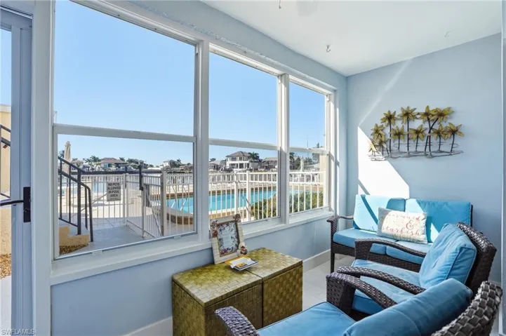 Lanai featuring impact windows that open for warm breezes while viewing the pool and basin
