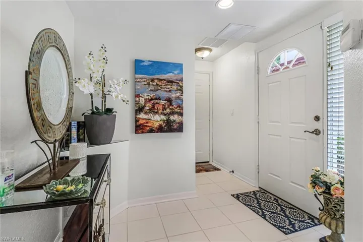 Foyer featuring light tile flooring