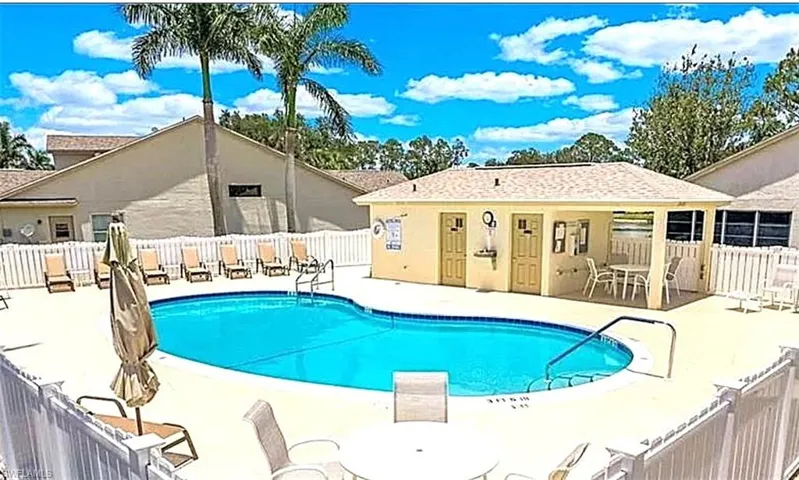 Community pool with a patio area