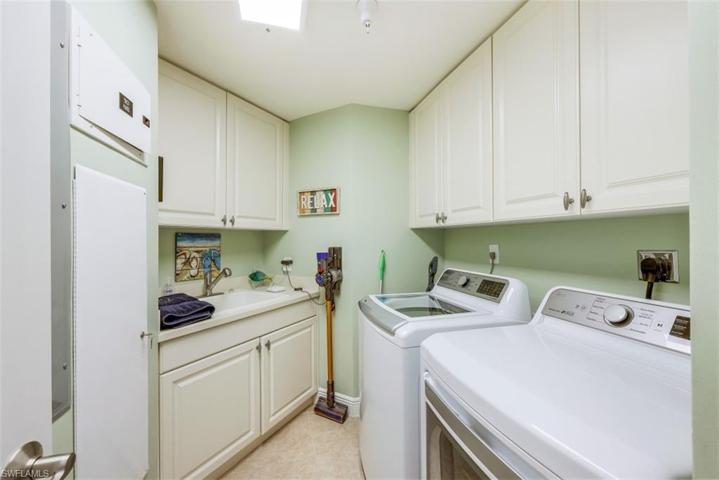 Great laundry area with sink and lots of storage