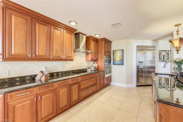 Large kitchen with lots of cabinets and counters