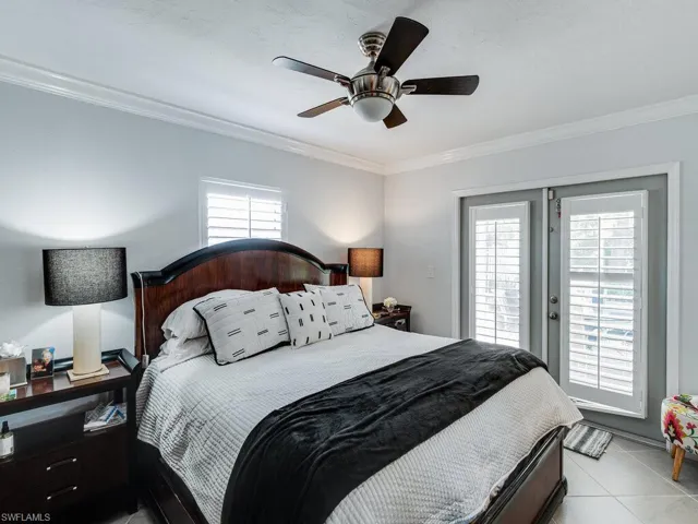 Primary Bedroom with French doors to the pool