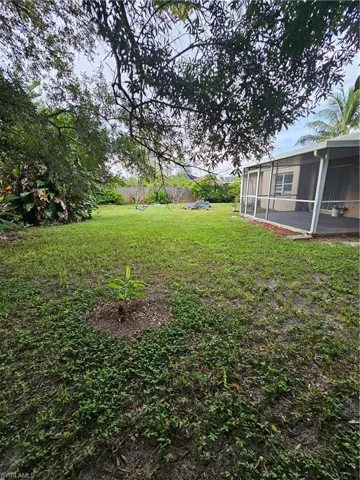 View of yard with a sunroom