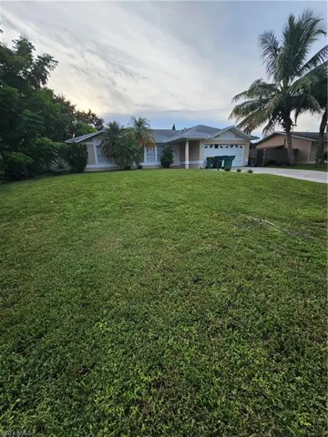 View of yard with a garage