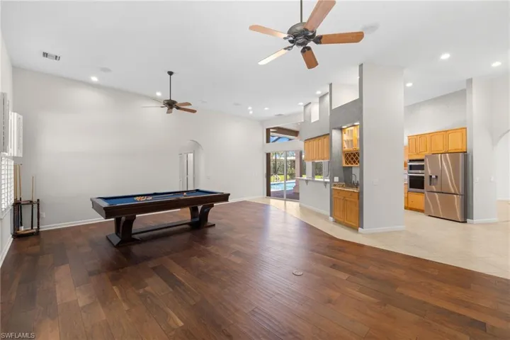 Spacious interior with vaulted ceilings and wood-finish flooring