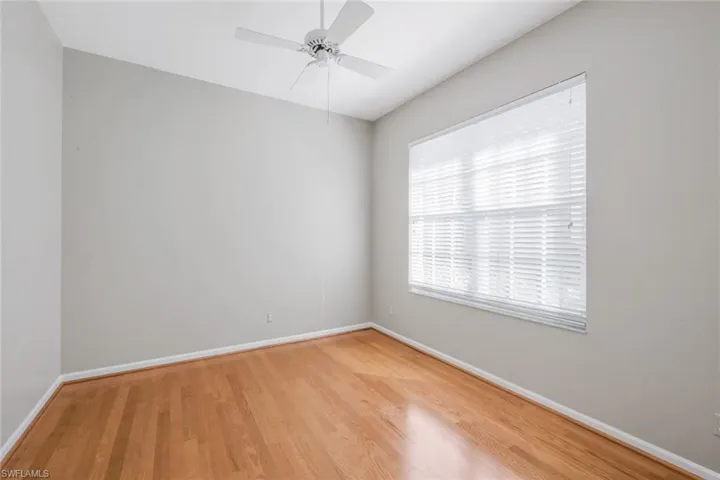 Unfurnished room featuring ceiling fan and light hardwood / wood-style flooring