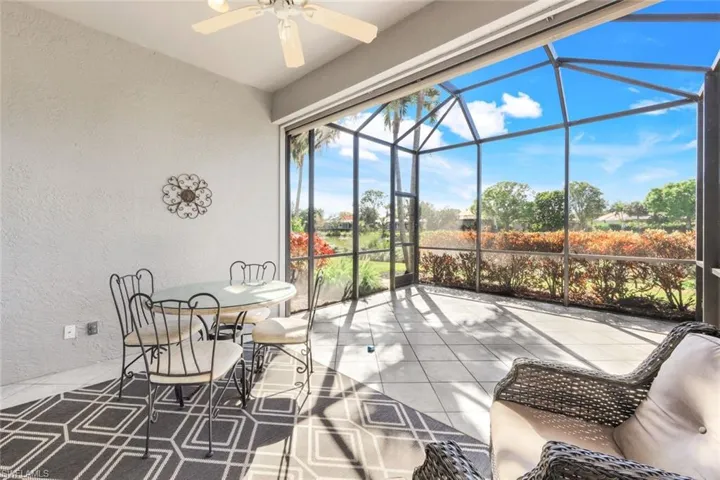 Sunroom featuring ceiling fan