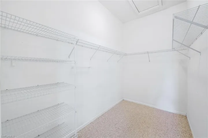 Walk in closet featuring carpet flooring