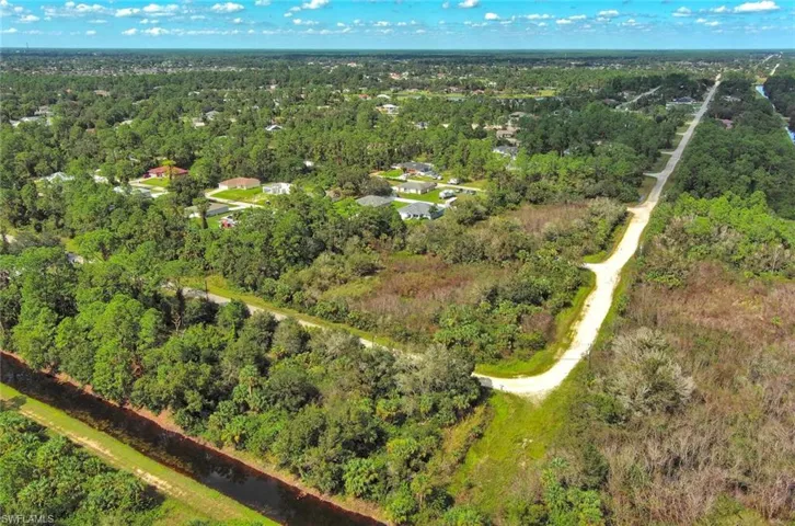 Aerial overview of property's location with a forest