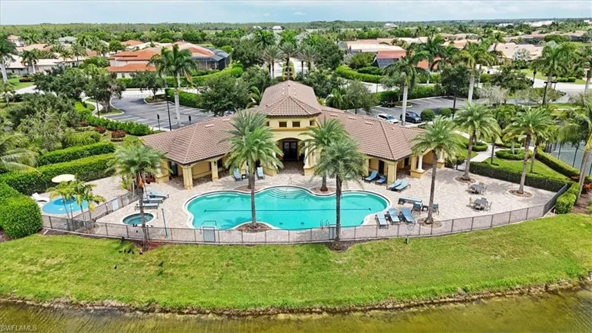 View of pool with a water view and a patio area
