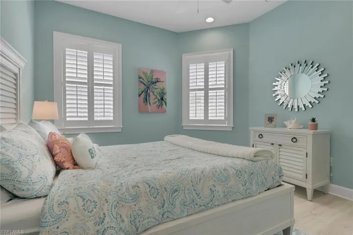 Bedroom with a ceiling fan and light wood finished floors