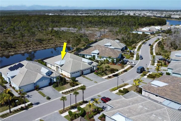 Aerial view of residential area with a large body of water
