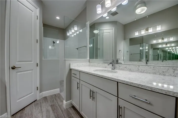 Modern bathroom beautifully tiled walk-in shower and private toilet room