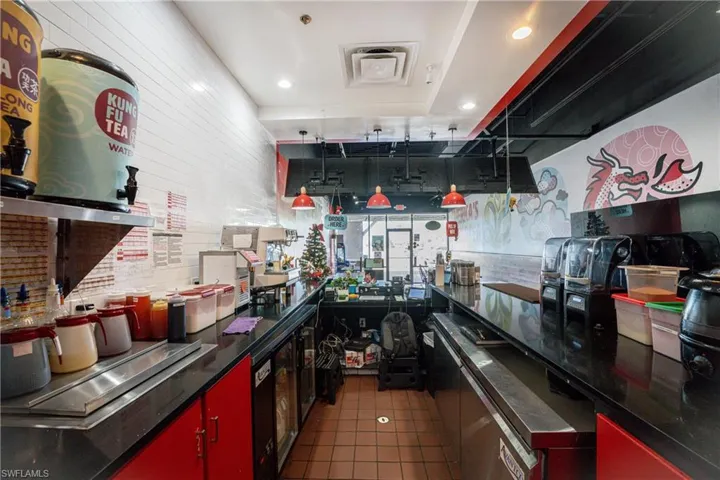 Kitchen with dark tile patterned floors