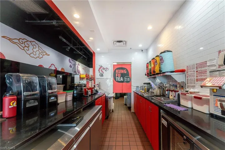 Kitchen with dark tile patterned floors