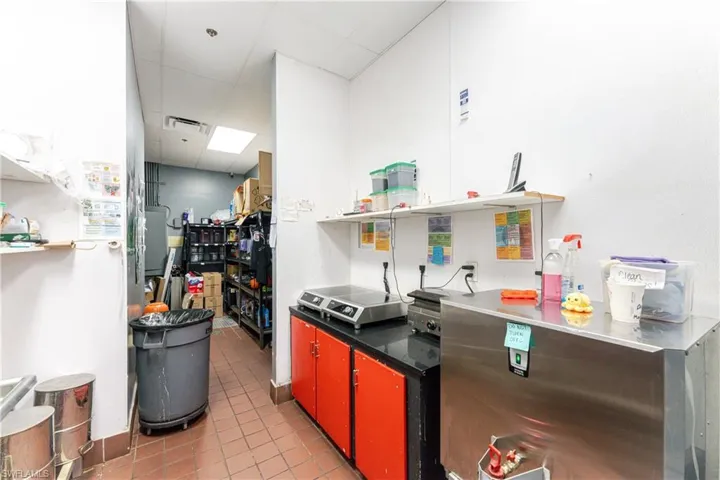 Kitchen with a paneled ceiling and tile patterned flooring