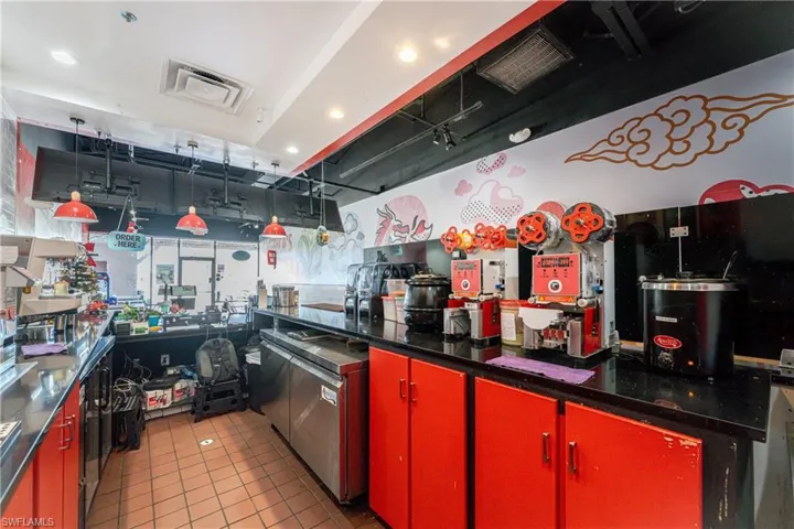 Kitchen with light tile patterned floors