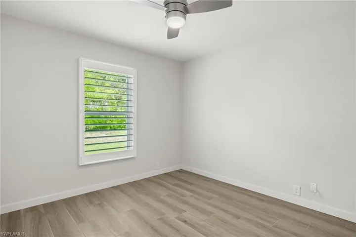 Spare room with ceiling fan and light hardwood / wood-style flooring