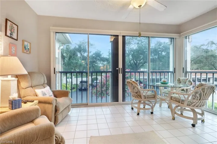 Glass enclosed lanai which opens to allow the comfortable winter air inside.