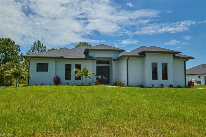 Prairie-style home with a front lawn