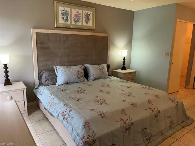 Bedroom with light tile patterned floors