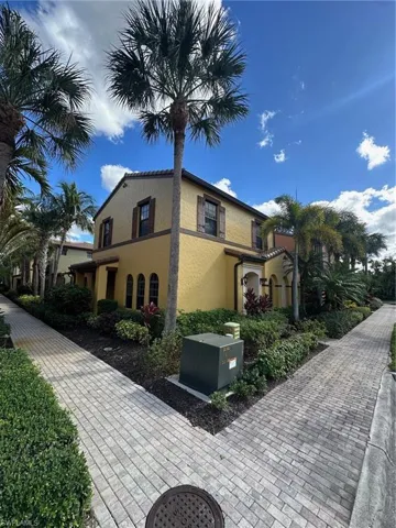 View of side of home featuring stucco siding
