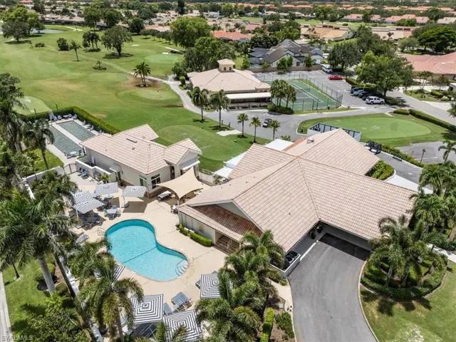 Aerial view of a pool area and a local golf course