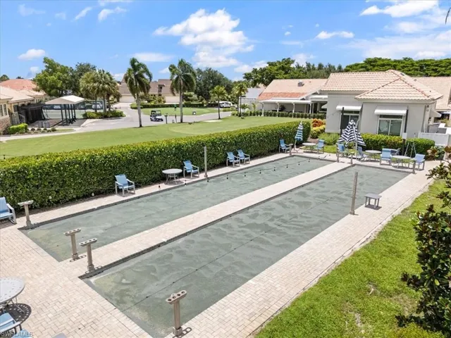View of property's community with a bocce ball area and shuffleboard